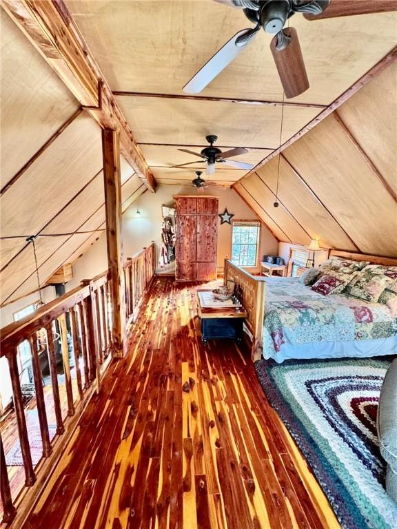 23045 Liberty Trl, Natural Dam, AR 72948 - bedroom featuring hardwood / wood-style floors and vaulted ceiling