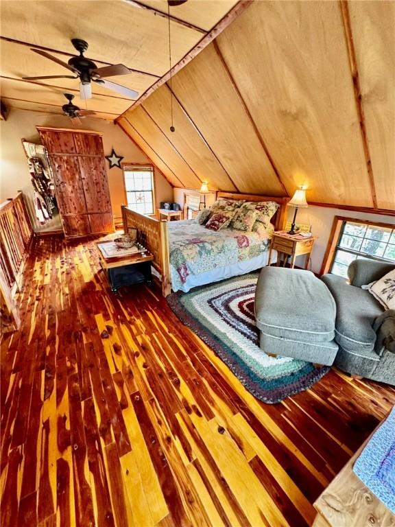 23045 Liberty Trl, Natural Dam, AR 72948 - bedroom featuring wood ceiling, multiple windows, lofted ceiling, and hardwood / wood-style flooring