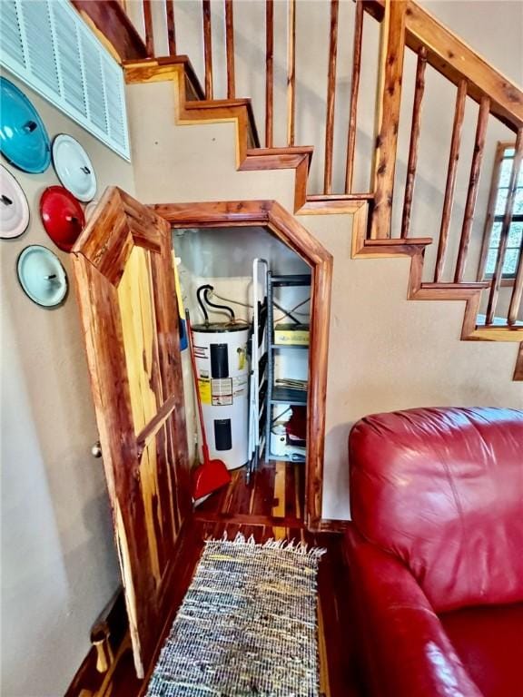 23045 Liberty Trl, Natural Dam, AR 72948 - staircase featuring water heater and wood finished floors