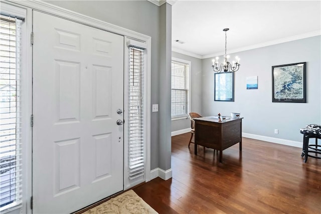 entrance foyer featuring baseboards, an inviting chandelier, crown molding, dark wood-type flooring, and visible vents