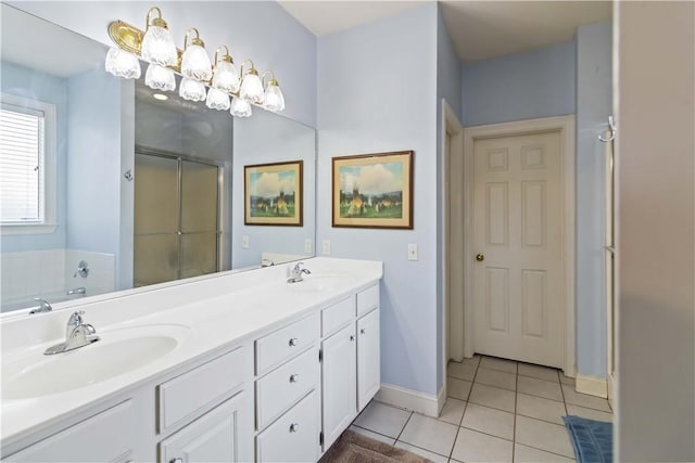 full bathroom with tile patterned floors, double vanity, a sink, and a stall shower
