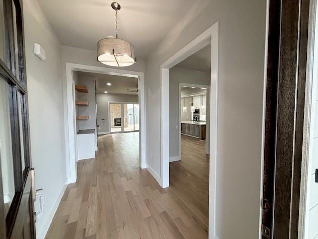 7919 Via Roma Ave, Springdale, AR 72762 - corridor with light wood finished floors and baseboards