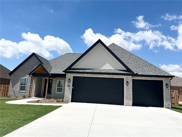 7919 Via Roma Ave, Springdale, AR 72762 - view of front facade with an attached garage, driveway, and brick siding