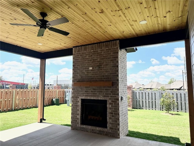 7919 Via Roma Ave, Springdale, AR 72762 - view of patio / terrace with an outdoor brick fireplace and a ceiling fan