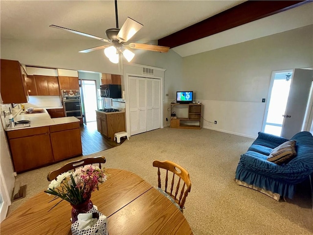 2509 Bradley Ln, Russellville, AR 72801 - dining space with baseboards, ceiling fan, a wealth of natural light, and vaulted ceiling with beams