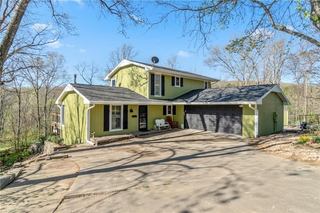 30 Strichen Dr, Bella Vista, AR 72715 - view of front of home with an attached garage, driveway, and a porch