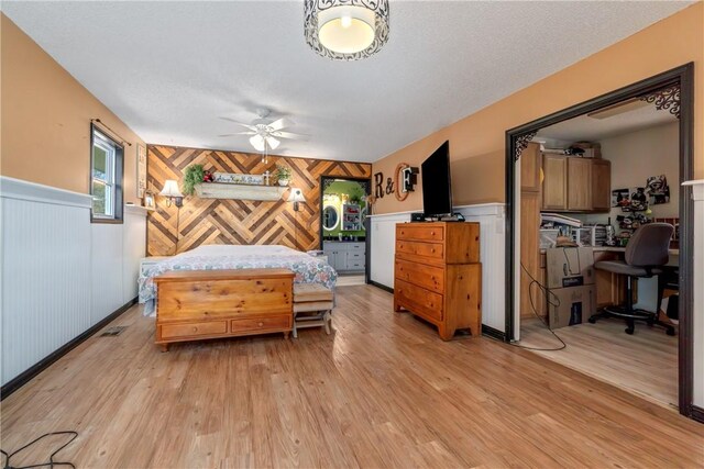 30 Strichen Dr, Bella Vista, AR 72715 - bedroom with wood walls, wainscoting, light wood-type flooring, and visible vents
