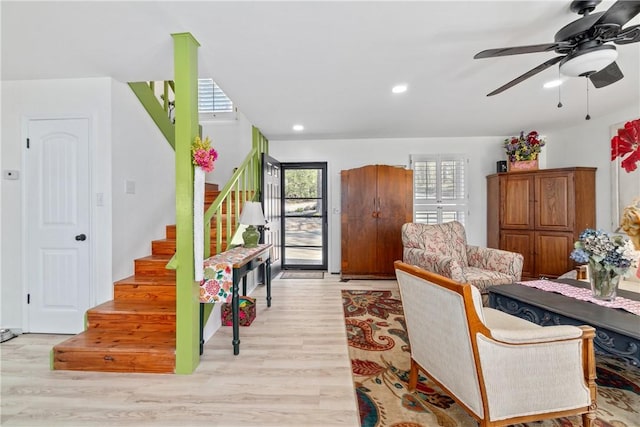 30 Strichen Dr, Bella Vista, AR 72715 - living area with plenty of natural light, wood finished floors, and stairs