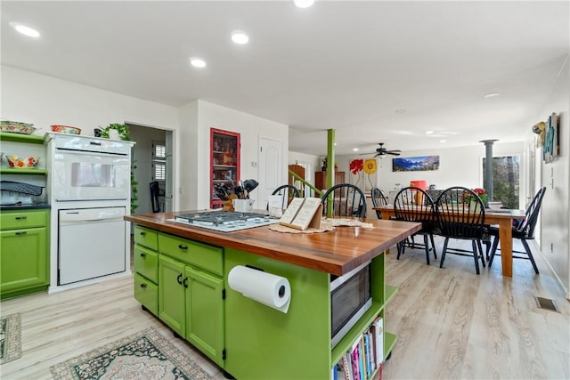 30 Strichen Dr, Bella Vista, AR 72715 - kitchen featuring butcher block counters, white appliances, green cabinets, and visible vents