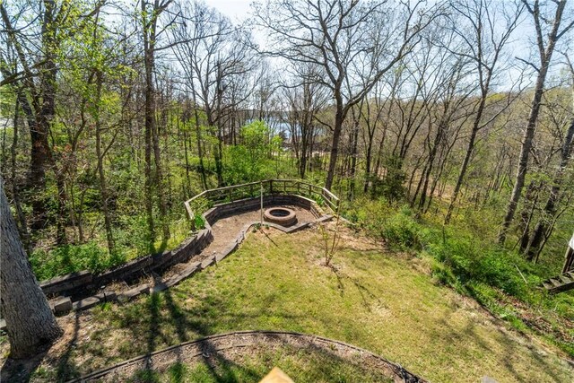 30 Strichen Dr, Bella Vista, AR 72715 - view of yard with a wooded view and a fire pit