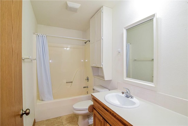 full bathroom with visible vents, shower / tub combo, vanity, tile patterned floors, and toilet