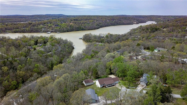aerial view with a water view and a forest view