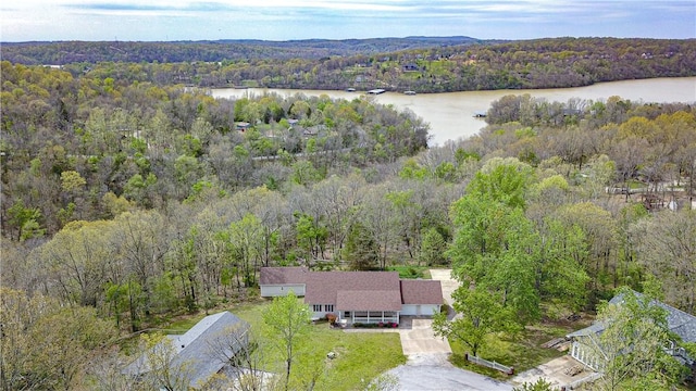 bird's eye view with a water view and a view of trees