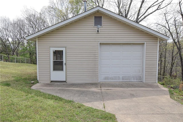 detached garage featuring concrete driveway