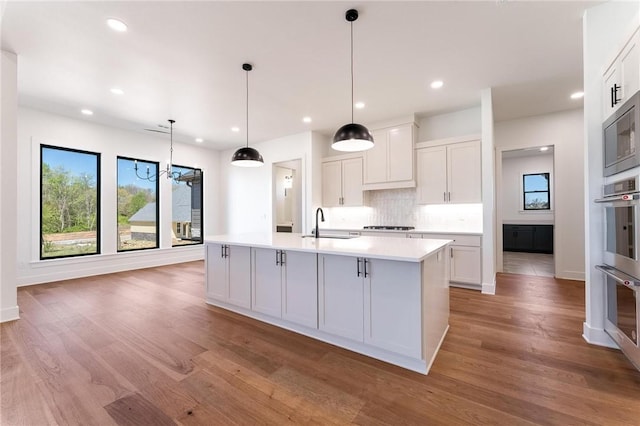 3601 Beaverhead, Bentonville, AR 72712 - kitchen with plenty of natural light, light wood-style flooring, light countertops, and a sink