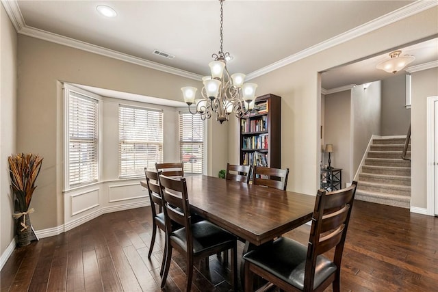 4502 SW Alfalfa Ave, Bentonville, AR 72713 - dining area featuring dark wood finished floors, a chandelier, stairway, crown molding, and recessed lighting
