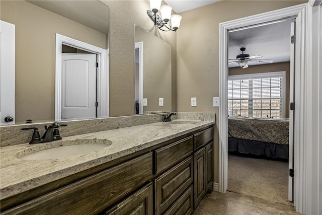 4502 SW Alfalfa Ave, Bentonville, AR 72713 - bathroom with double vanity, ensuite bath, and ceiling fan