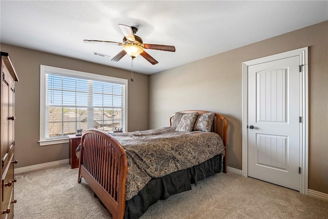 4502 SW Alfalfa Ave, Bentonville, AR 72713 - bedroom featuring light colored carpet and a ceiling fan