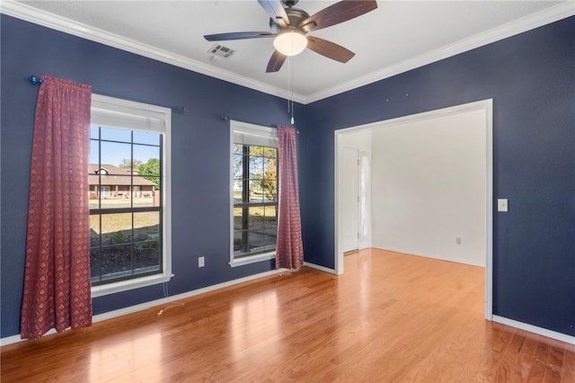 503 Oakwood St, Lowell, AR 72745 - unfurnished room featuring crown molding, wood finished floors, a ceiling fan, and baseboards
