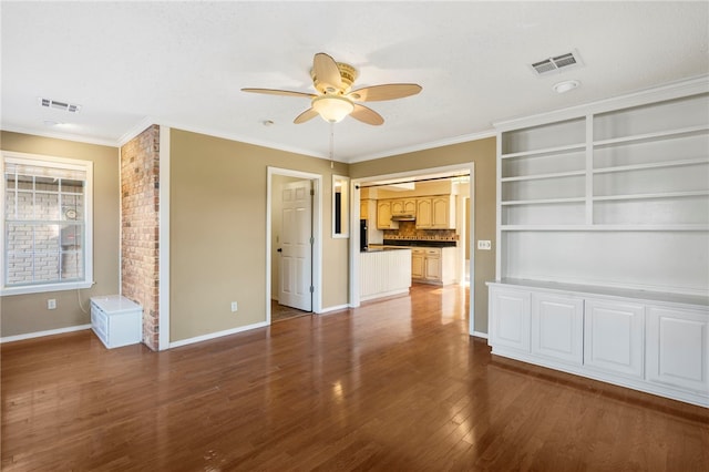 unfurnished living room with wood finished floors, baseboards, a ceiling fan, and visible vents