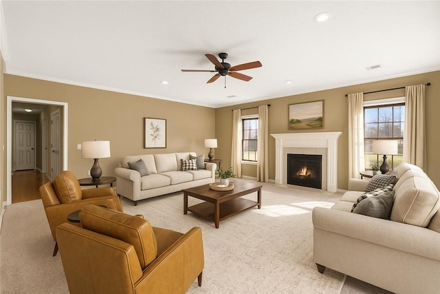 503 Oakwood St, Lowell, AR 72745 - living room featuring crown molding, a fireplace with flush hearth, healthy amount of natural light, a ceiling fan, and baseboards