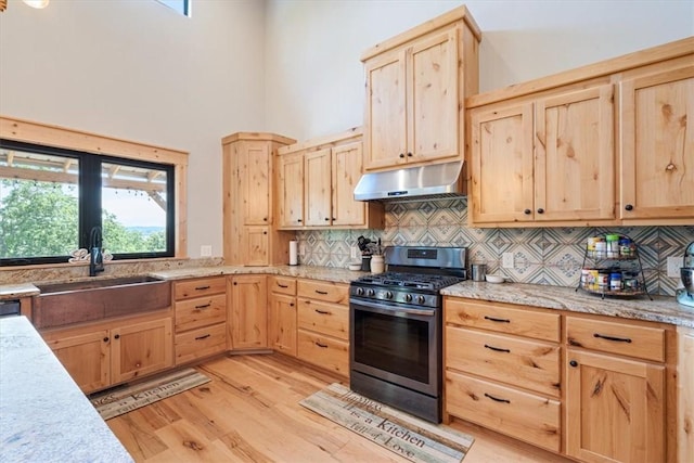 13936 Deepwater Dr, Garfield, AR 72732 - kitchen with light brown cabinetry, stainless steel gas range oven, and under cabinet range hood