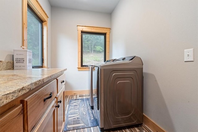 13936 Deepwater Dr, Garfield, AR 72732 - laundry room featuring baseboards, wood finished floors, cabinet space, and washing machine and dryer