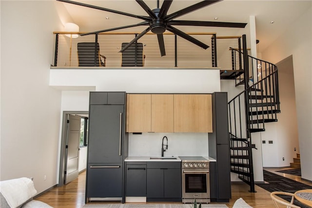 1104 N Fillmore St, Bentonville, AR 72712 - kitchen with high end appliances, a ceiling fan, a high ceiling, and a sink