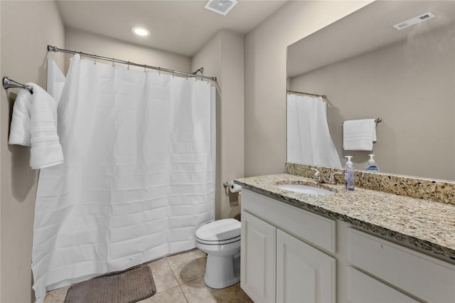 full bathroom featuring toilet, visible vents, tile patterned flooring, and vanity