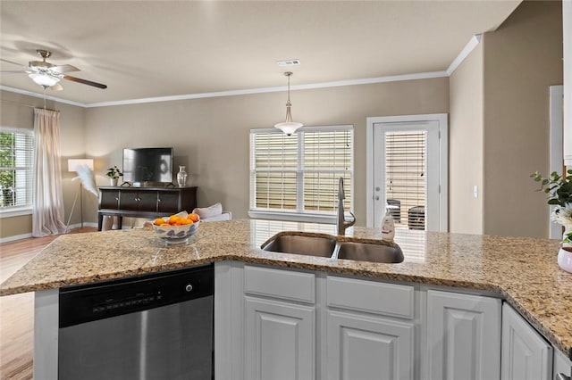 kitchen with a sink, ceiling fan, stainless steel dishwasher, and white cabinets