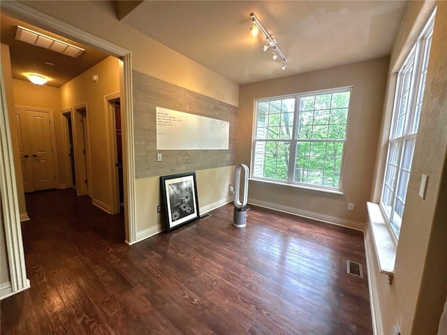 1 Binham Ln, Bella Vista, AR 72715 - unfurnished living room with a fireplace, baseboards, dark wood finished floors, and track lighting