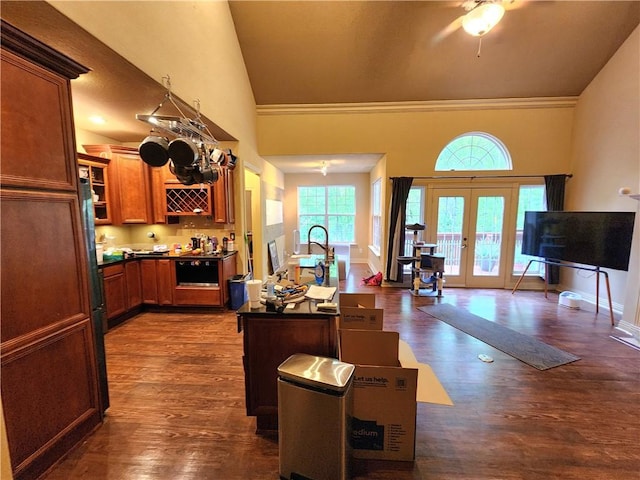 1 Binham Ln, Bella Vista, AR 72715 - kitchen with french doors, dark countertops, dark wood-style floors, ceiling fan, and a kitchen island