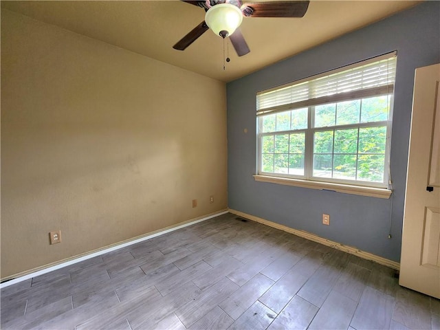 1 Binham Ln, Bella Vista, AR 72715 - spare room with a ceiling fan, baseboards, and wood finished floors