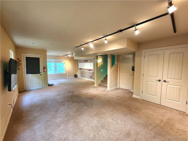 1 Binham Ln, Bella Vista, AR 72715 - basement featuring track lighting, stairway, light carpet, and baseboards