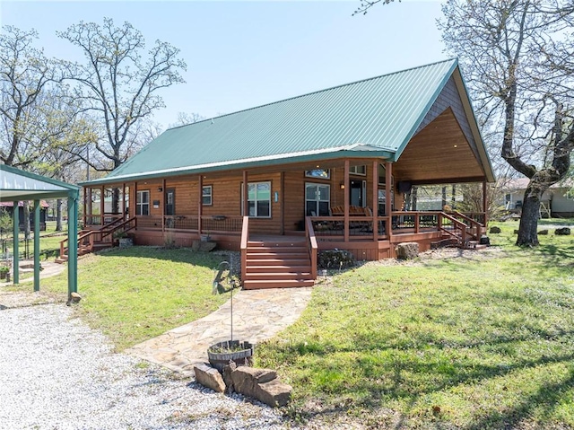 95951 Manns Dr, Gore, OK 74435 - view of front of house with a porch, a front lawn, and metal roof