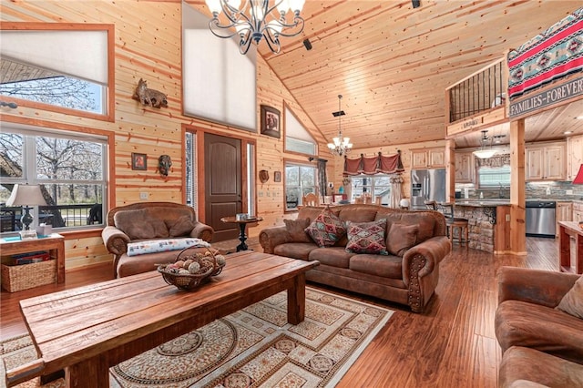 95951 Manns Dr, Gore, OK 74435 - living area featuring hardwood / wood-style floors, wooden walls, wood ceiling, high vaulted ceiling, and a notable chandelier