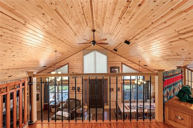 95951 Manns Dr, Gore, OK 74435 - bonus room featuring lofted ceiling, wooden walls, wood finished floors, wooden ceiling, and ceiling fan with notable chandelier