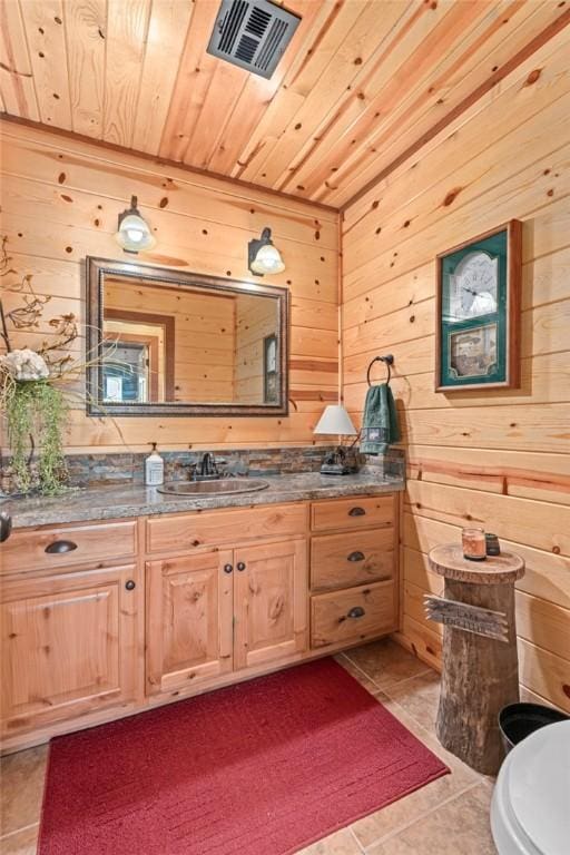 95951 Manns Dr, Gore, OK 74435 - bathroom featuring wood ceiling, wooden walls, and visible vents