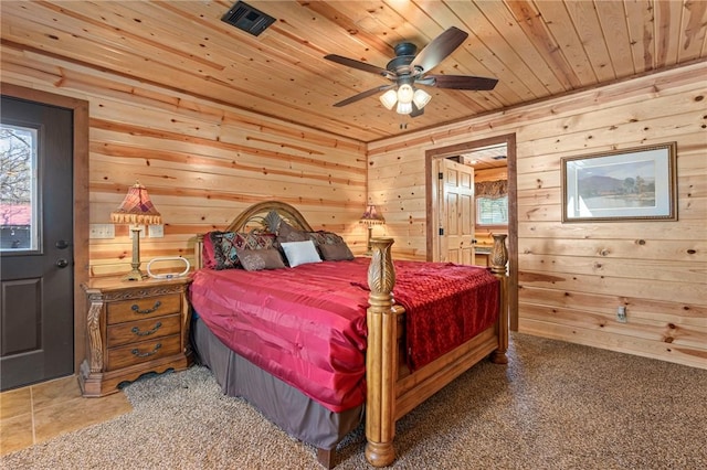 95951 Manns Dr, Gore, OK 74435 - bedroom featuring visible vents, wooden ceiling, wood walls, and multiple windows