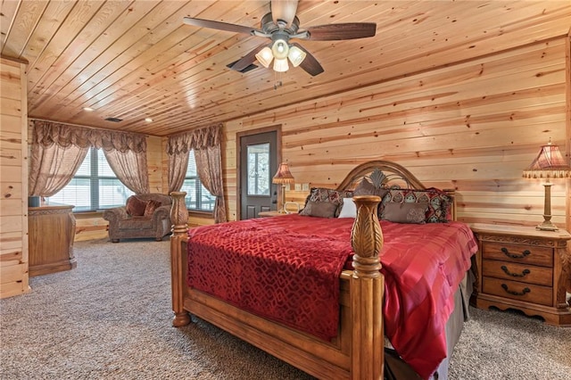 95951 Manns Dr, Gore, OK 74435 - carpeted bedroom featuring wood ceiling, multiple windows, and wooden walls
