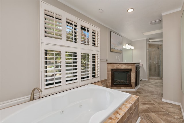 22 Cromarty Ln, Bella Vista, AR 72715 - bathroom with ornamental molding, a whirlpool tub, a stall shower, a glass covered fireplace, and recessed lighting