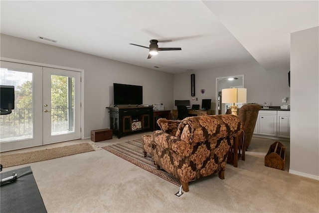 22 Cromarty Ln, Bella Vista, AR 72715 - living room featuring light colored carpet, french doors, ceiling fan, and baseboards