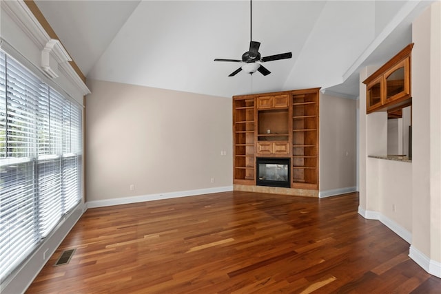 3902 NE Cadbury Ave, Bentonville, AR 72712 - unfurnished living room with healthy amount of natural light, a ceiling fan, wood finished floors, a multi sided fireplace, and high vaulted ceiling