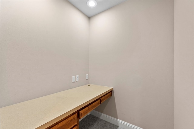 3902 NE Cadbury Ave, Bentonville, AR 72712 - unfurnished office with built in desk, baseboards, and carpet floors