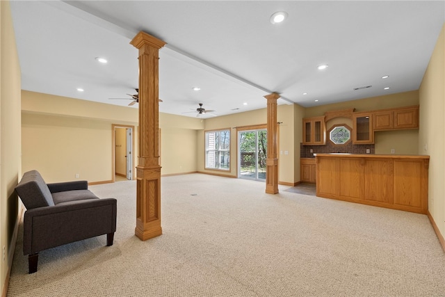 3902 NE Cadbury Ave, Bentonville, AR 72712 - living area featuring decorative columns, light carpet, baseboards, a ceiling fan, and recessed lighting
