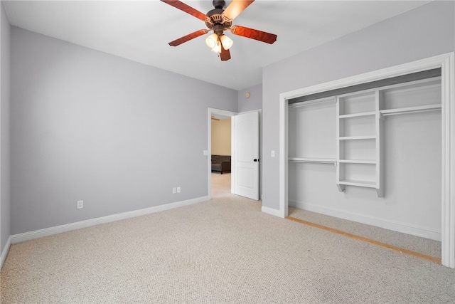 3902 NE Cadbury Ave, Bentonville, AR 72712 - unfurnished bedroom with carpet, baseboards, a closet, and a ceiling fan