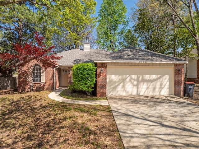1762 Oxford Pl, Springdale, AR 72764 - single story home with brick siding, driveway, a chimney, and a garage