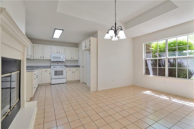 1762 Oxford Pl, Springdale, AR 72764 - kitchen with white appliances, light tile patterned flooring, a chandelier, and white cabinetry