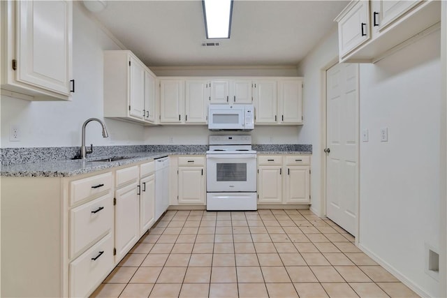 1762 Oxford Pl, Springdale, AR 72764 - kitchen with white appliances, a sink, light stone counters, and white cabinetry