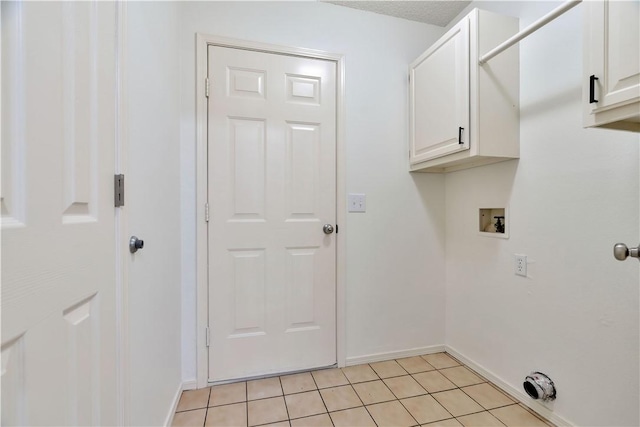 1762 Oxford Pl, Springdale, AR 72764 - clothes washing area with cabinet space, light tile patterned floors, baseboards, and washer hookup